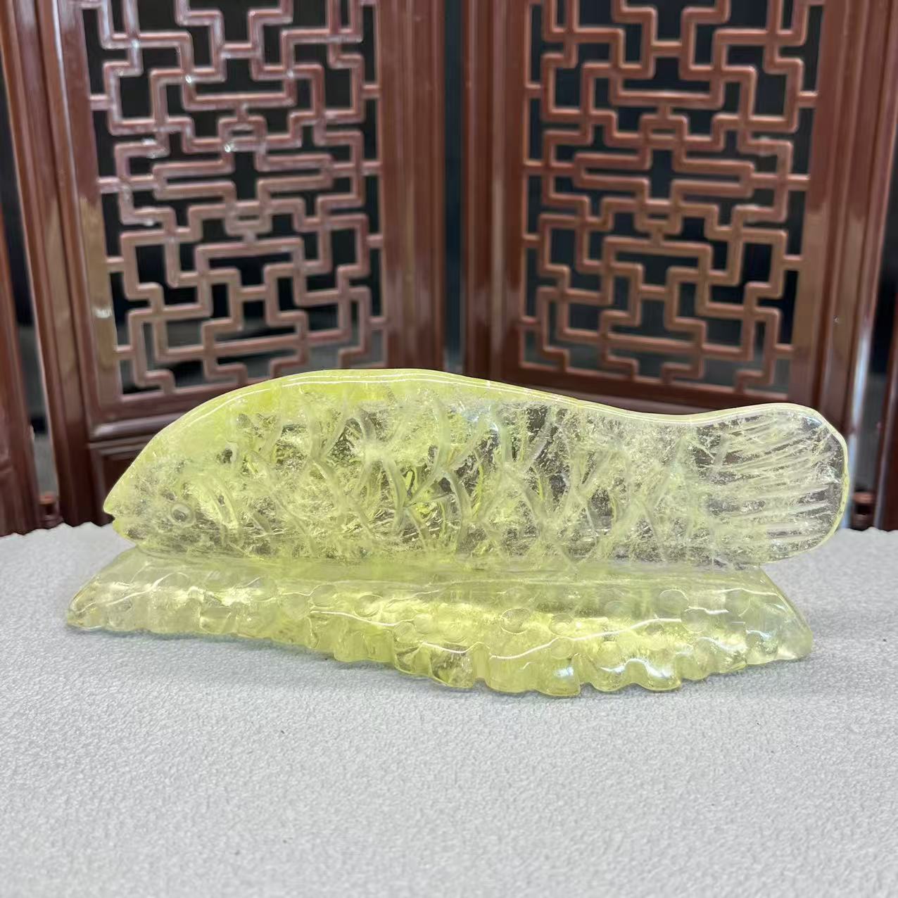 Natural citrine sphere carving of koi