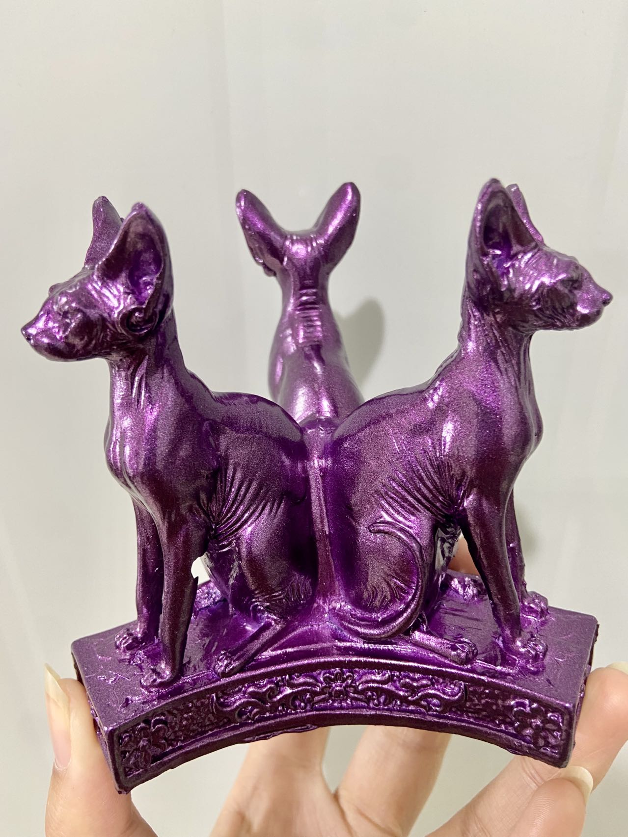 Three cat sphere stand