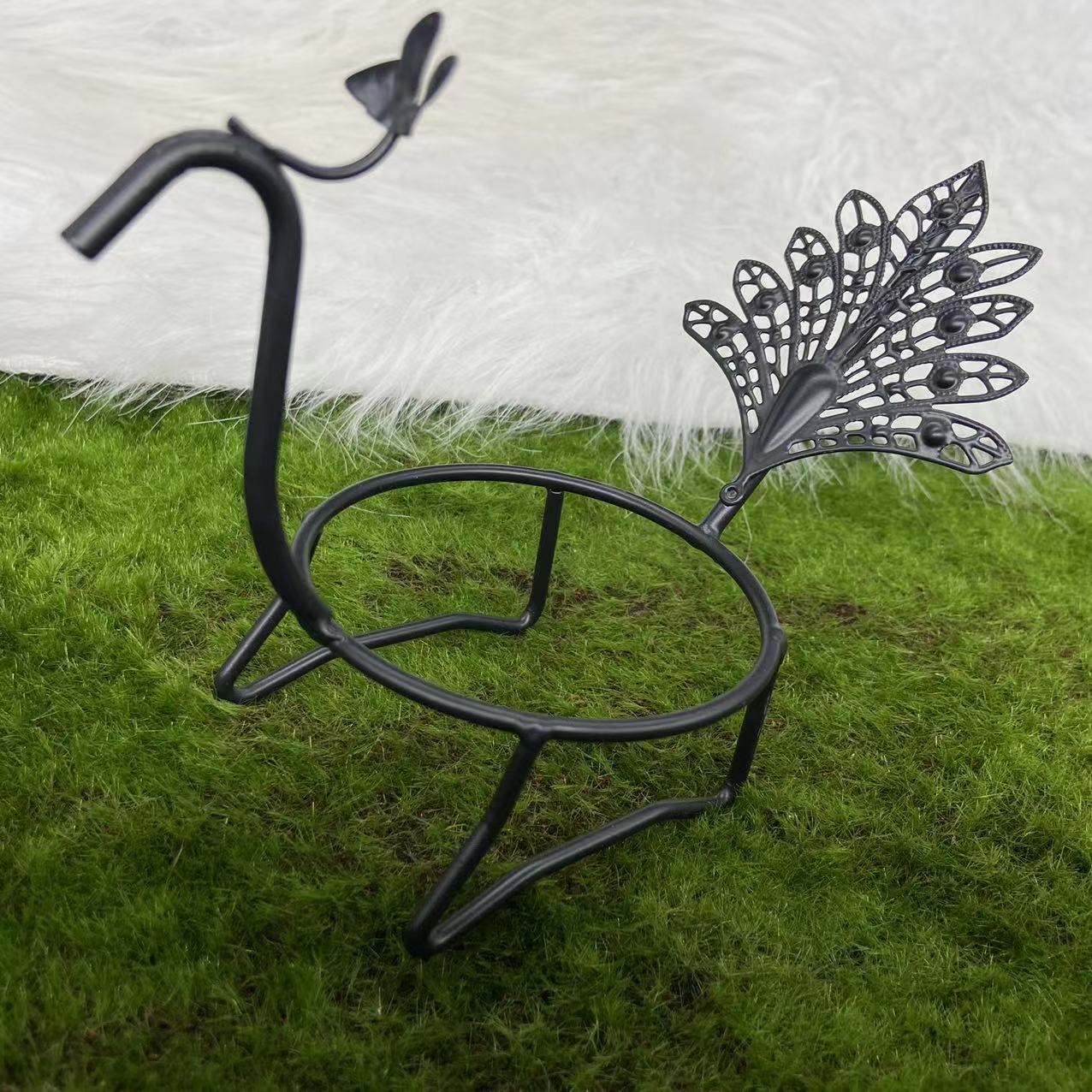Peacock sphere stand